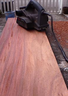 Solid Narra slabs being planed